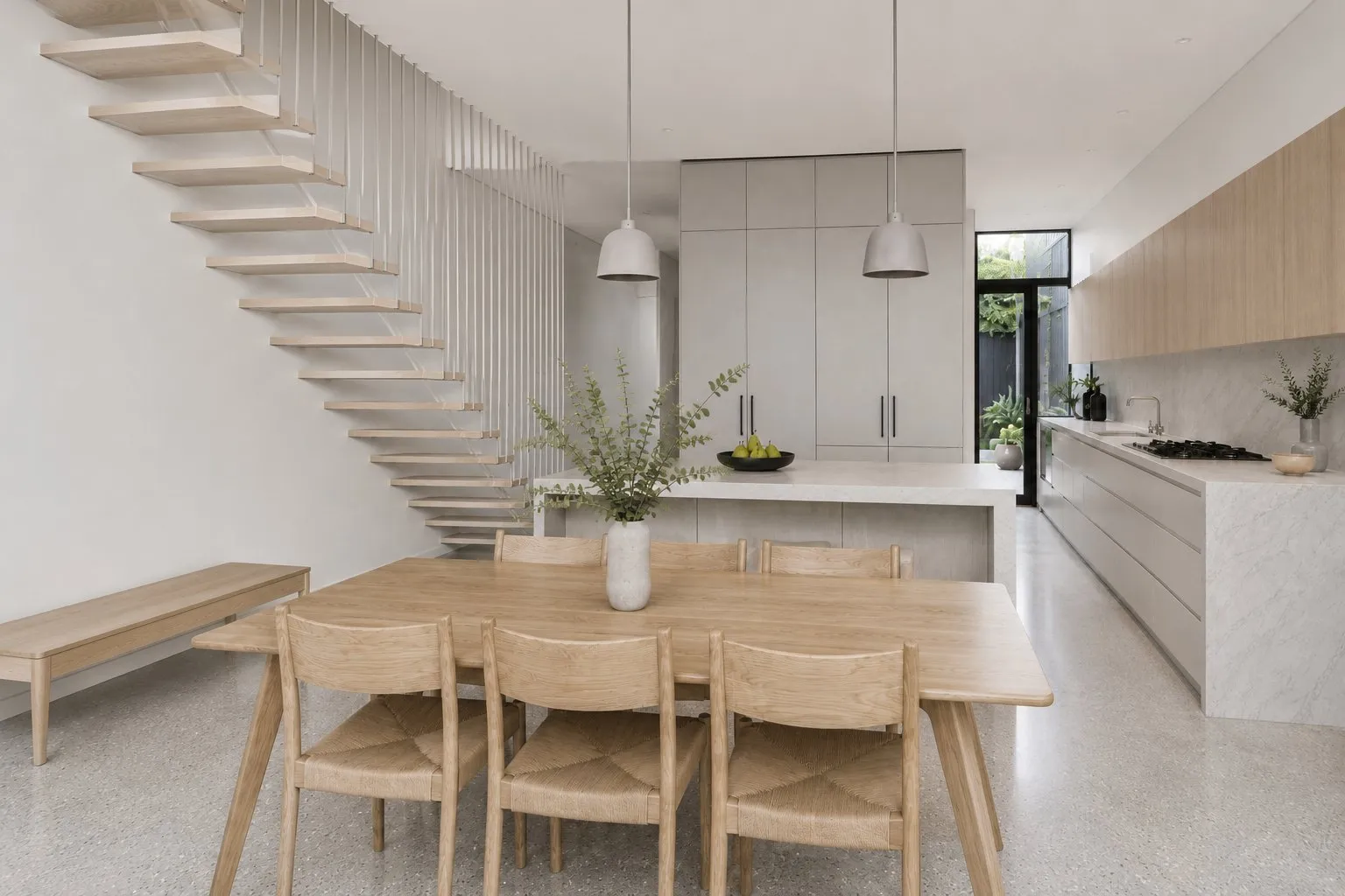 Richmond terrace renovation — open plan dining and kitchen with floating staircase, inner Melbourne